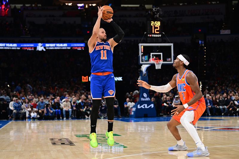 OKLAHOMA CITY, OKLAHOMA - JANUARY 03: Jalen Bunson #11 of the New York Knicks goes up for a shot during the second half against the Oklahoma City Thunder at Paycom Center on January 3, 2025 in Oklahoma City, Oklahoma. NOTE TO USER: User expressly acknowledges and agrees that, by downloading and or using this photograph, User is consenting to the terms and conditions of the Getty Images License Agreement. (Photo by Joshua Gateley/Getty Images)