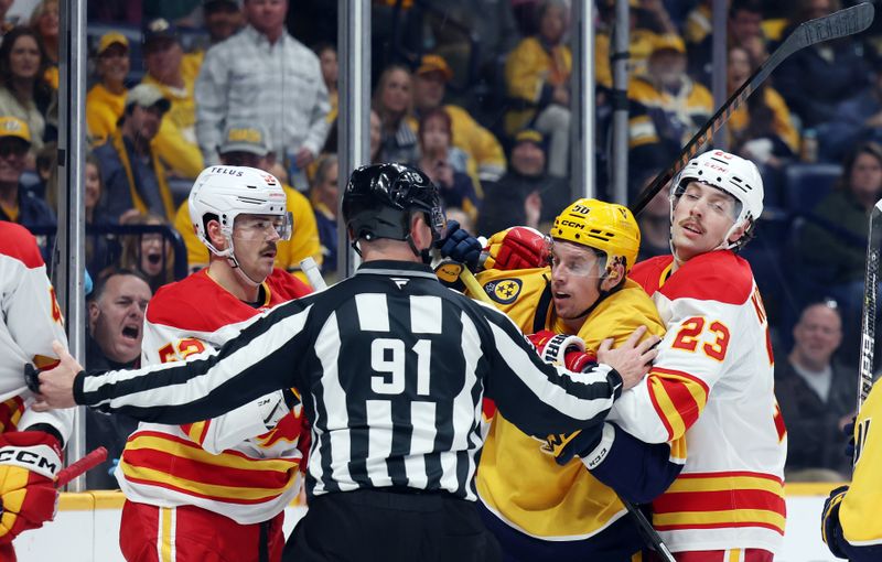 Nov 1, 2025; Nashville, Tennessee, USA; Nashville Predators left wing Eric Houla (56) battles with Calgary Flames defenseman MacKenzie Weegar (52) and center Justin Kirkland (23) after the whistle during the first period at Bridgestone Arena. Mandatory Credit: Alan Poizner-Imagn Images
