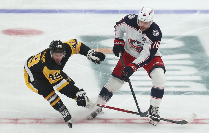 Sep 27, 2025; Pittsburgh, Pennsylvania, USA; Columbus Blue Jackets center Brendan Gaunce (16) moves the puck against Pittsburgh Penguins left wing Rafael Harvey-Pinard (49) during the second period at PPG Paints Arena. Mandatory Credit: Charles LeClaire-Imagn Images