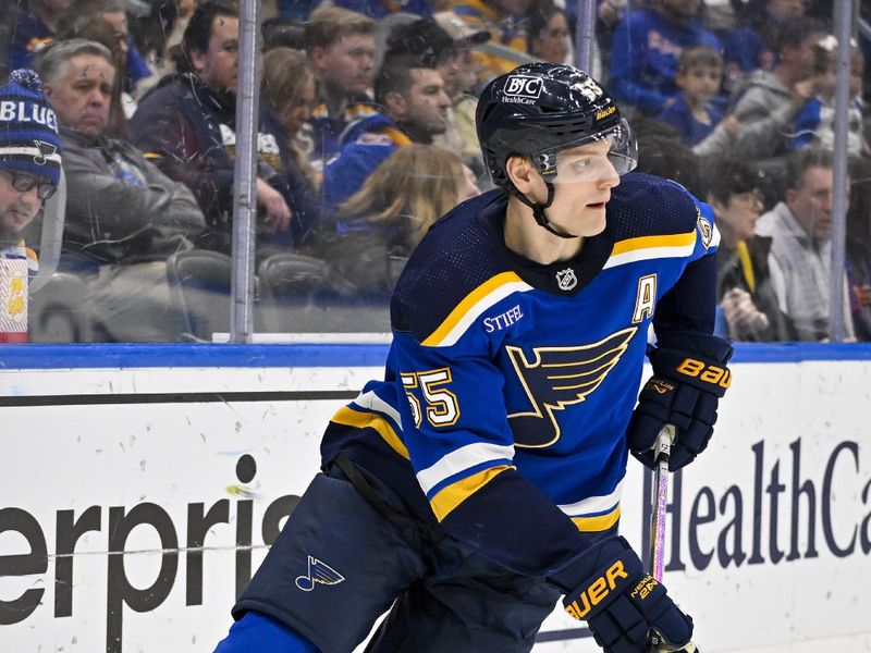 Jan 11, 2024; St. Louis, Missouri, USA;  St. Louis Blues defenseman Colton Parayko (55) controls the puck against the New York Rangers during the third period at Enterprise Center. Mandatory Credit: Jeff Curry-USA TODAY Sports