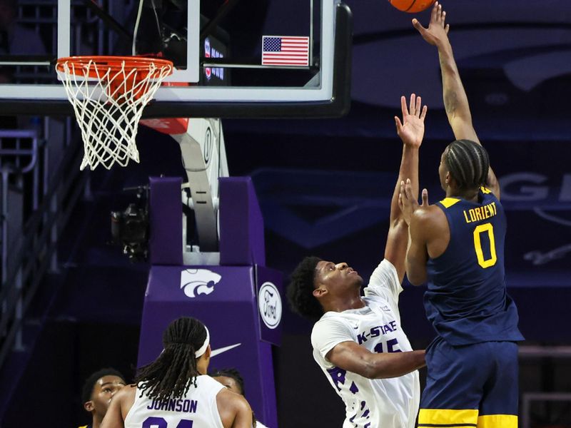 Mar 3, 2026; Manhattan, Kansas, USA; West Virginia Mountaineers forward Brenen Lorient (0) shoots against Kansas State Wildcats forward Taj Manning (15) during the second half at Bramlage Coliseum. Mandatory Credit: Scott Sewell-Imagn Images