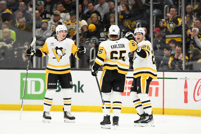 Jan 4, 2024; Boston, Massachusetts, USA; Pittsburgh Penguins center Lars Eller (20) reacts with defenseman Erik Karlsson (65) after scoring a goal during the first period against the Boston Bruins at TD Garden. Mandatory Credit: Bob DeChiara-USA TODAY Sports