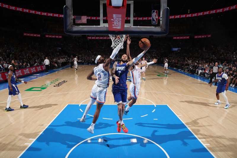 OKLAHOMA CITY, OK - FEBRUARY 22:  Amir Coffey #7 of the LA Clippers drives to the basket during the game against the Oklahoma City Thunder on February 22SF, 2024 at Paycom Arena in Oklahoma City, Oklahoma. NOTE TO USER: User expressly acknowledges and agrees that, by downloading and or using this photograph, User is consenting to the terms and conditions of the Getty Images License Agreement. Mandatory Copyright Notice: Copyright 2024 NBAE (Photo by Zach Beeker/NBAE via Getty Images)