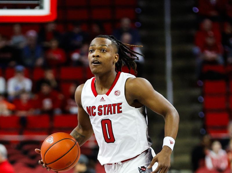 Dec 20, 2023; Raleigh, North Carolina, USA; North Carolina State Wolfpack guard DJ Horne (0) dribbles with the ball during the first half against Saint Louis at PNC Arena. Mandatory Credit: Jaylynn Nash-USA TODAY Sports