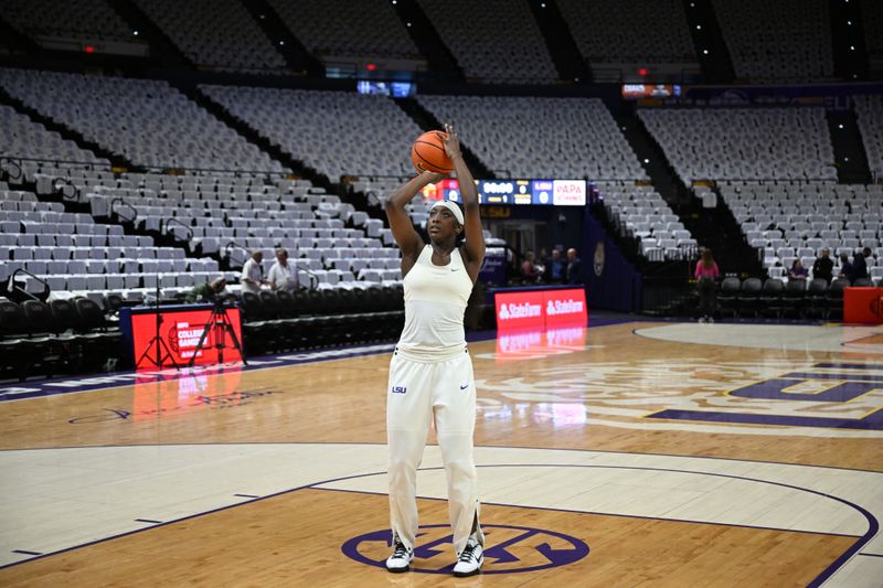 Jan 25, 2024; Baton Rouge, Louisiana, USA; LSU Lady Tigers guard Flau'jae Johnson warms up surrounded by white shirts before a game against the South Carolina Gamecocks at Pete Maravich Assembly Center. Mandatory Credit: Matthew Hinton-USA TODAY Sports