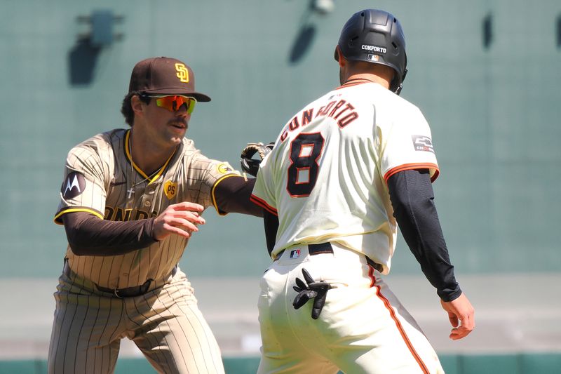 Apr 5, 2024; San Francisco, California, USA; San Diego Padres third baseman Graham Pauley (22) tags out San Francisco Giants left fielder Michael Conforto (8) during the fourth inning at Oracle Park. Mandatory Credit: Kelley L Cox-USA TODAY Sports