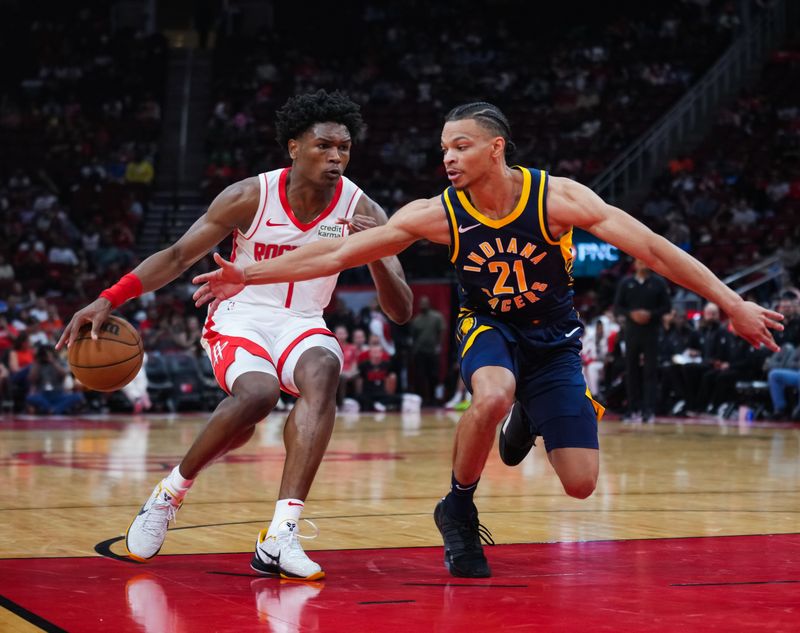 HOUSTON, TEXAS - OCTOBER 10: Amen Thompson #1 of the Houston Rockets dribbles the ball against Isaiah Wong #21 of the Indiana Pacers during the preseason game at Toyota Center on October 10, 2023 in Houston, Texas. NOTE TO USER: User expressly acknowledges and agrees that, by downloading and or using this photograph, User is consenting to the terms and conditions of the Getty Images License Agreement. (Photo by Alex Bierens de Haan/Getty Images)