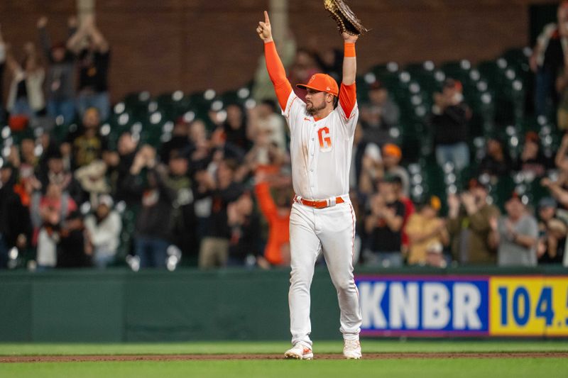 Aug 29, 2023; San Francisco, California, USA;  San Francisco Giants first baseman J.D. Davis (7) celebrates the catch by San Francisco Giants center fielder Austin Slater (not pictured) against the Cincinnati Reds during the eighth inning at Oracle Park. Mandatory Credit: Neville E. Guard-USA TODAY Sports