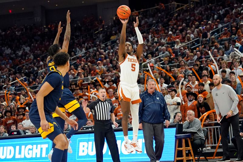 Feb 11, 2023; Austin, Texas, USA; Texas Longhorns guard Marcus Carr (5) shoots during the first half against the West Virginia Mountaineers at Moody Center. Mandatory Credit: Scott Wachter-USA TODAY Sports