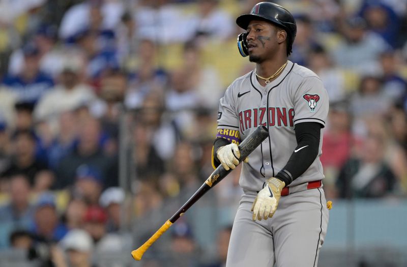 May 21, 2025; Los Angeles, California, USA; Arizona Diamondbacks shortstop Geraldo Perdomo (2) reacts after striking out during the second inning against the Los Angeles Dodgers at Dodger Stadium. Mandatory Credit: Jayne Kamin-Oncea-Imagn Images