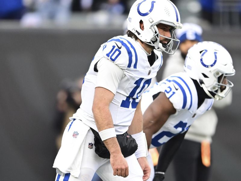 Indianapolis Colts quarterback Gardner Minshew (10) warms up before an NFL football game against the Cincinnati Bengals on Sunday, Dec. 10, 2023, in Cincinnati. (AP Photo/Emilee Chinn)