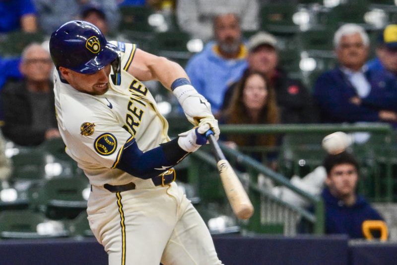 May 21, 2025; Milwaukee, Wisconsin, USA; Milwaukee Brewers third baseman Caleb Durbin (21) hits a double in the fifth inning against the Baltimore Orioles at American Family Field. Mandatory Credit: Benny Sieu-Imagn Images