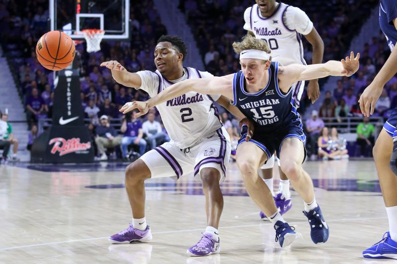 Feb 24, 2024; Manhattan, Kansas, USA; Kansas State Wildcats guard Tylor Perry (2) and Brigham Young Cougars guard Richie Saunders (15) go after a loose ball during the first half at Bramlage Coliseum. Mandatory Credit: Scott Sewell-USA TODAY Sports