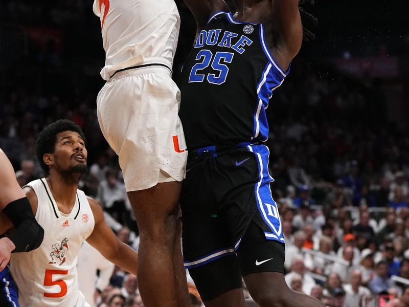 Feb 6, 2023; Coral Gables, Florida, USA; Duke Blue Devils forward Mark Mitchell (25) shoots the ball over Miami Hurricanes forward Norchad Omier (15) during the first half at Watsco Center. Mandatory Credit: Jasen Vinlove-USA TODAY Sports