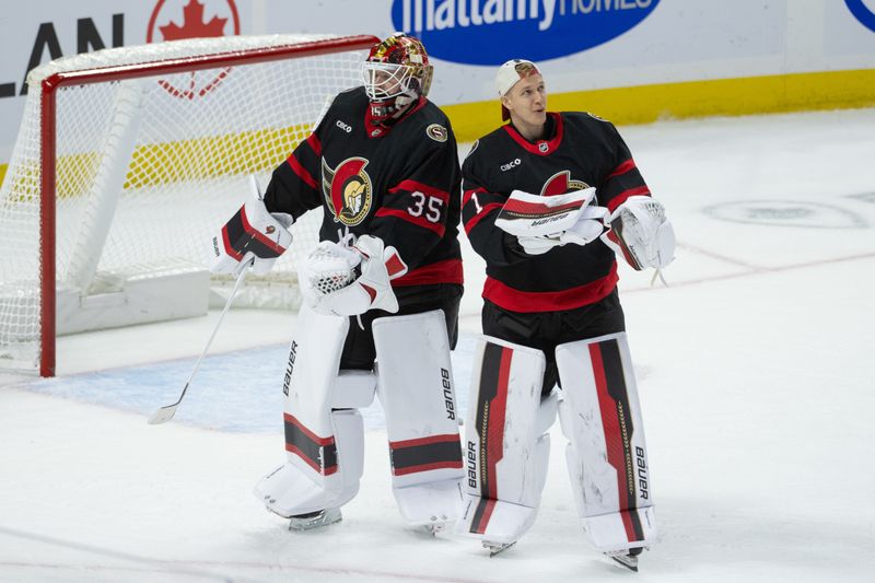 Oct 23, 2025; Ottawa, Ontario, CAN; Ottawa Senators goalies Linus Ullmark (35) and Leevi Merilainen (1) do a celebration dance following their win against the Philadelphia Flyers at the Canadian Tire Centre. Mandatory Credit: Marc DesRosiers-IMAGN Images