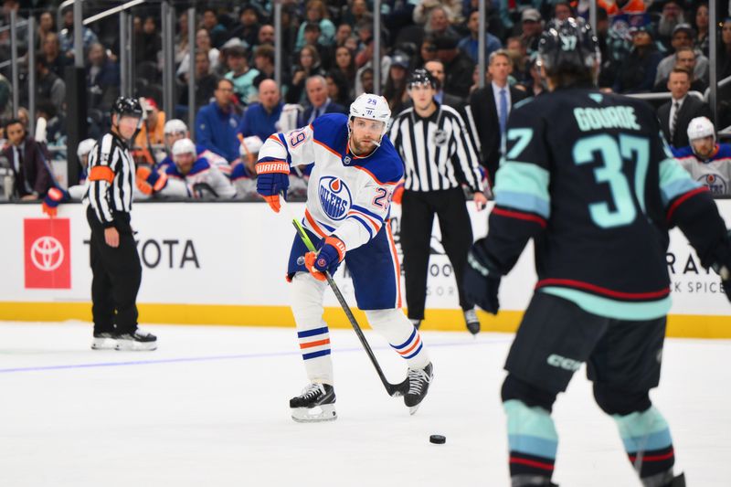 Oct 2, 2024; Seattle, Washington, USA; Edmonton Oilers center Leon Draisaitl (29) passes the puck against the Seattle Kraken during the second period at Climate Pledge Arena. Mandatory Credit: Steven Bisig-Imagn Images