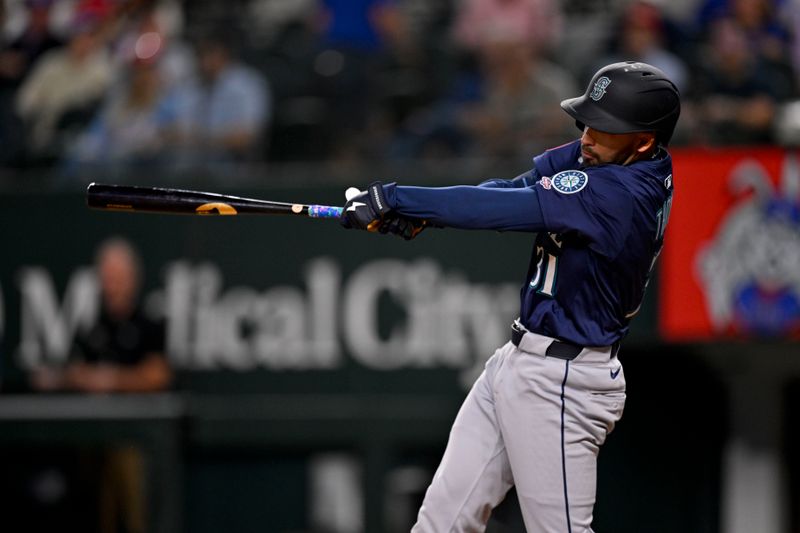 May 2, 2025; Arlington, Texas, USA; Seattle Mariners right fielder Rhylan Thomas (31) hits a double against the Texas Rangers during the fifth inning at Globe Life Field. Mandatory Credit: Jerome Miron-Imagn Images