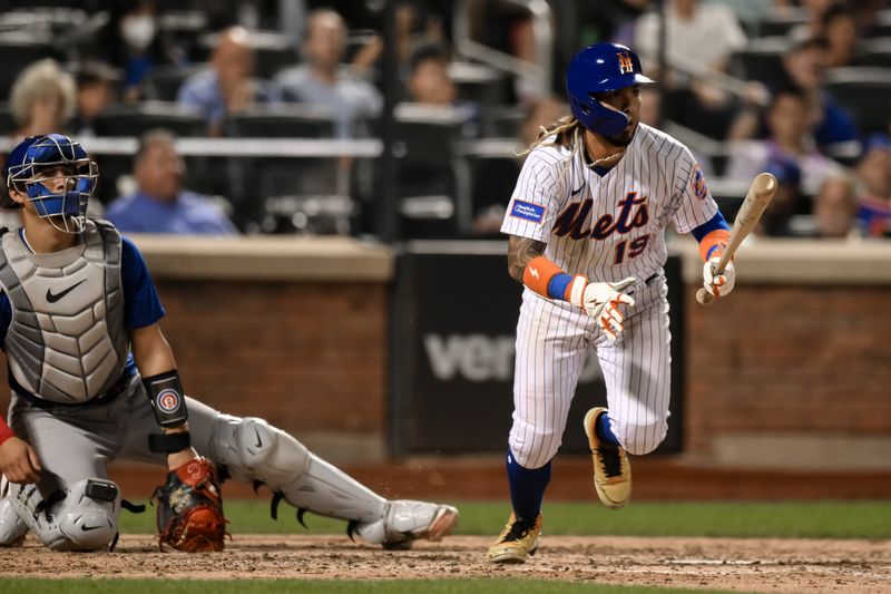 Aug 9, 2023; New York City, New York, USA; New York Mets second baseman Jonathan Arauz (19) hits an RBI single against the Chicago Cubs during the sixth inning at Citi Field. Mandatory Credit: John Jones-USA TODAY Sports