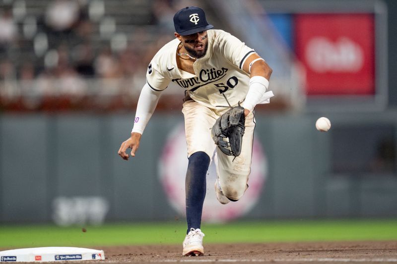 Sep 26, 2024; Minneapolis, Minnesota, USA; Minnesota Twins second base Willi Castro (50) fields the ball and throws out Miami Marlins second base Otto Lopez (61) in the sixth inning at Target Field. Mandatory Credit: Matt Blewett-Imagn Images