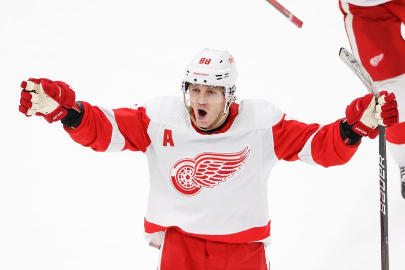 Feb 25, 2024; Chicago, Illinois, USA; Detroit Red Wings right wing Patrick Kane (88) celebrates after scoring game winning goal against the Chicago Blackhawks in overtime at United Center. Mandatory Credit: Kamil Krzaczynski-USA TODAY Sports