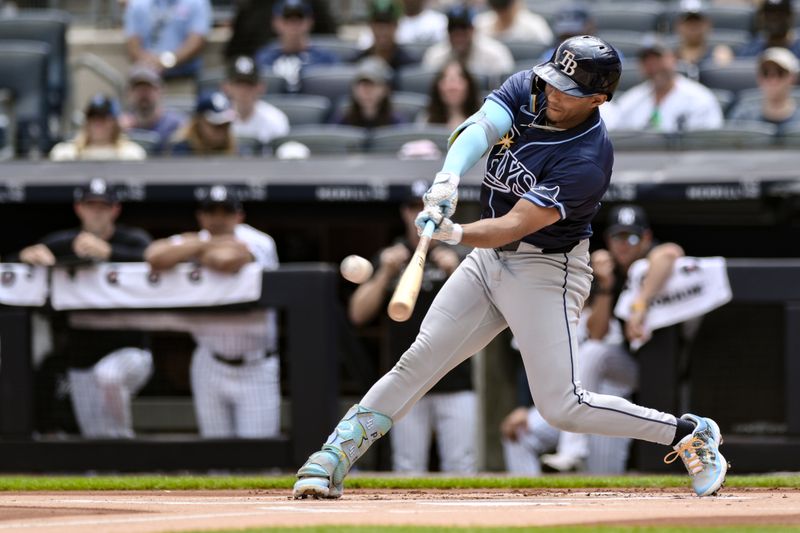 Jul 21, 2024; Bronx, New York, USA; Tampa Bay Rays outfielder Richie Palacios (1) hits a solo home run against the New York Yankees during the first inning at Yankee Stadium. Mandatory Credit: John Jones-USA TODAY Sports