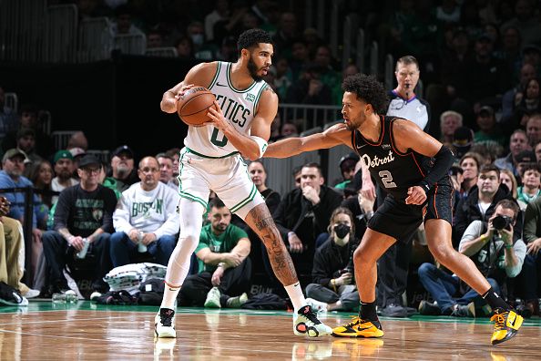 BOSTON, MA - DECEMBER 28: Jayson Tatum #0 of the Boston Celtics handles the ball while Cade Cunningham #2 of the Detroit Pistons plays defense during the game on December 28, 2023 at the TD Garden in Boston, Massachusetts. NOTE TO USER: User expressly acknowledges and agrees that, by downloading and or using this photograph, User is consenting to the terms and conditions of the Getty Images License Agreement. Mandatory Copyright Notice: Copyright 2023 NBAE  (Photo by Brian Babineau/NBAE via Getty Images)