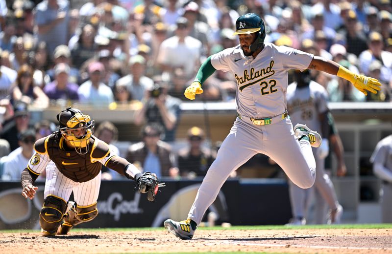 Jun 12, 2024; San Diego, California, USA; Oakland Athletics left fielder Miguel Andrujar (22) scores a run ahead of the tag by San Diego Padres catcher Luis Campusano (12) during the sixth inning at Petco Park. Mandatory Credit: Orlando Ramirez-USA TODAY Sports