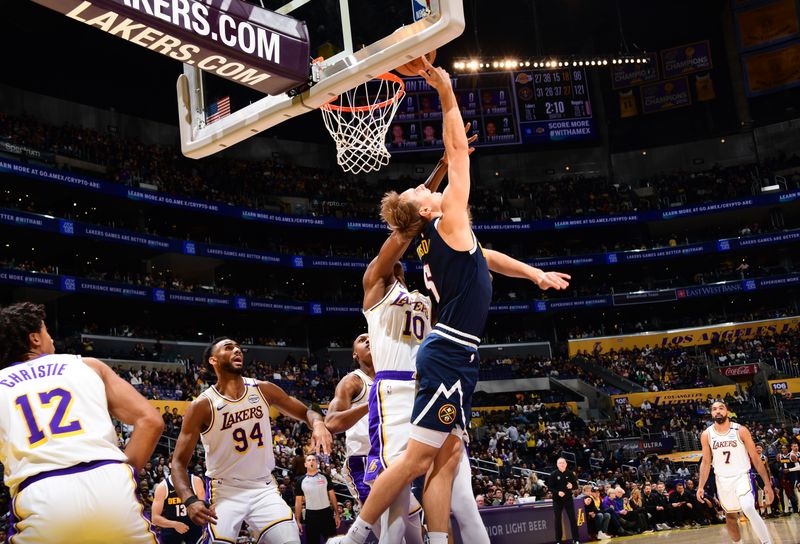 LOS ANGELES, CA - NOVEMBER 23: Hunter Tyson #5 of the Denver Nuggets drives to the basket during the game against the Los Angeles Lakers on November 23, 2024 at Crypto.Com Arena in Los Angeles, California. NOTE TO USER: User expressly acknowledges and agrees that, by downloading and/or using this Photograph, user is consenting to the terms and conditions of the Getty Images License Agreement. Mandatory Copyright Notice: Copyright 2024 NBAE (Photo by Adam Pantozzi/NBAE via Getty Images)