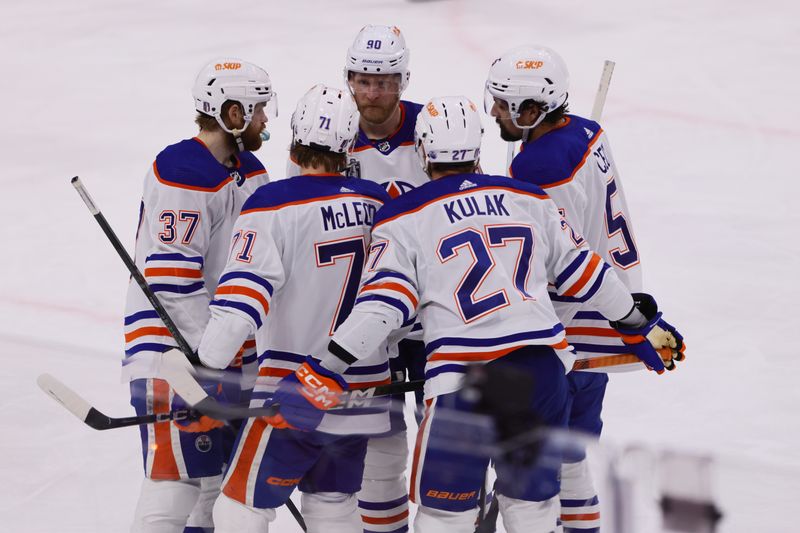 Jun 24, 2024; Sunrise, Florida, USA; Edmonton Oilers talk before a faceoff against the Florida Panthers during the second period in game seven of the 2024 Stanley Cup Final at Amerant Bank Arena. Mandatory Credit: Sam Navarro-USA TODAY Sports