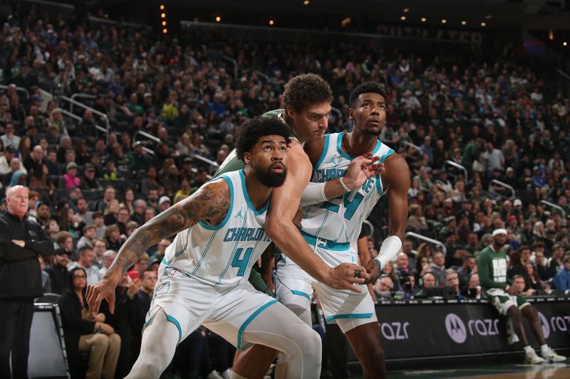 MILWAUKEE, WI - FEBRUARY 9: Nick Richards and Brandon Miller of the Charlotte Hornets boxes out during the game against the Milwaukee Bucks on February 9, 2024 at the Fiserv Forum Center in Milwaukee, Wisconsin. NOTE TO USER: User expressly acknowledges and agrees that, by downloading and or using this Photograph, user is consenting to the terms and conditions of the Getty Images License Agreement. Mandatory Copyright Notice: Copyright 2024 NBAE (Photo by Gary Dineen/NBAE via Getty Images).