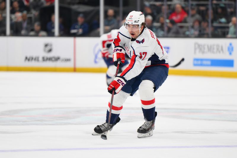 Mar 14, 2024; Seattle, Washington, USA; Washington Capitals center Dylan Strome (17) advances the puck against the Seattle Kraken during the first period at Climate Pledge Arena. Mandatory Credit: Steven Bisig-USA TODAY Sports