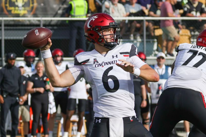 Oct 29, 2022; Orlando, Florida, USA; Cincinnati Bearcats quarterback Ben Bryant (6) throws a pass during the first quarter against the UCF Knights at FBC Mortgage Stadium. Mandatory Credit: Mike Watters-USA TODAY Sports