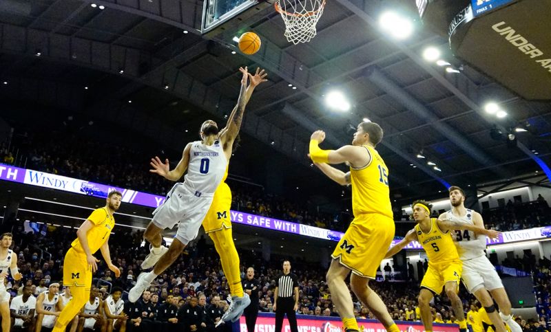 Feb 2, 2023; Evanston, Illinois, USA; Northwestern Wildcats guard Chase Audige (1) scores against the Michigan Wolverines during the second half at Welsh-Ryan Arena. Mandatory Credit: David Banks-USA TODAY Sports