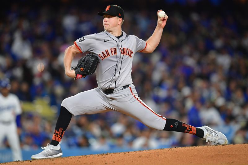 Apr 3, 2024; Los Angeles, California, USA; San Francisco Giants starting pitcher Kyle Harrison (45) throws against the Los Angeles Dodgers during the fourth inning at Dodger Stadium. Mandatory Credit: Gary A. Vasquez-USA TODAY Sports