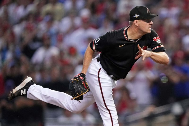 Oct 20, 2023; Phoenix, Arizona, USA; Arizona Diamondbacks relief pitcher Joe Mantiply (35) pitches during the first inning against the Philadelphia Phillies in game four of the NLCS for the 2023 MLB playoffs at Chase Field. Mandatory Credit: Joe Camporeale-USA TODAY Sports