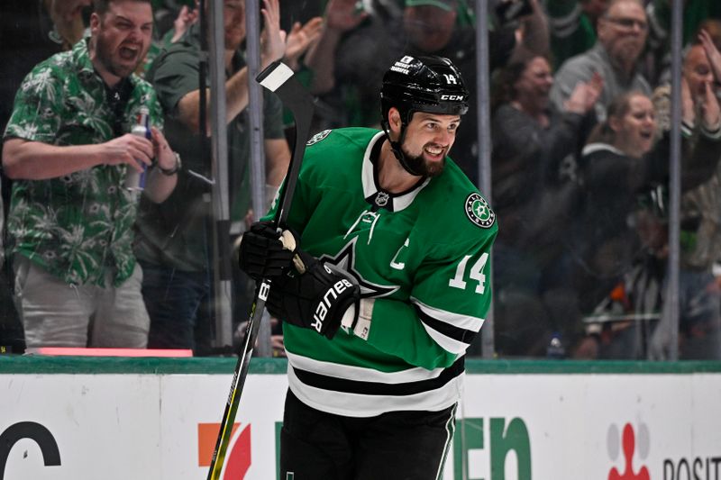 Oct 26, 2024; Dallas, Texas, USA; Dallas Stars left wing Jamie Benn (14) smiles after he scores a goal against Chicago Blackhawks goaltender Petr Mrazek (not pictured) during the second period at the American Airlines Center. Mandatory Credit: Jerome Miron-Imagn Images