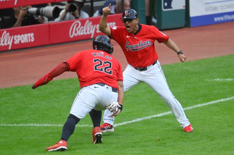 Jun 23, 2024; Cleveland, Ohio, USA; Cleveland Guardians third base and infield coach Rouglas Odor (53) reacts beside Cleveland Guardians first baseman Josh Naylor (22) in the third inning against the Toronto Blue Jays at Progressive Field. Mandatory Credit: David Richard-USA TODAY Sports
