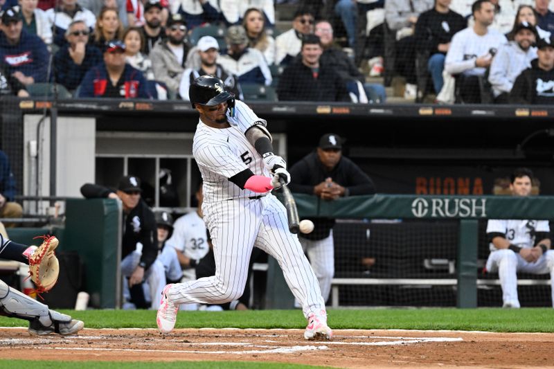 May 11, 2024; Chicago, Illinois, USA;  Chicago White Sox catcher Martín Maldonado (15) hits an RBI single against the Cleveland Guardians during the second inning at Guaranteed Rate Field. Mandatory Credit: Matt Marton-USA TODAY Sports