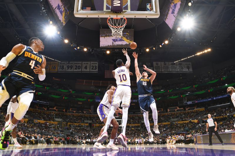 LOS ANGELES, CA - NOVEMBER 23: Nikola Jokic #15 of the Denver Nuggets shoots the ball during the game against the Los Angeles Lakers on November 23, 2024 at Crypto.Com Arena in Los Angeles, California. NOTE TO USER: User expressly acknowledges and agrees that, by downloading and/or using this Photograph, user is consenting to the terms and conditions of the Getty Images License Agreement. Mandatory Copyright Notice: Copyright 2024 NBAE (Photo by Adam Pantozzi/NBAE via Getty Images)