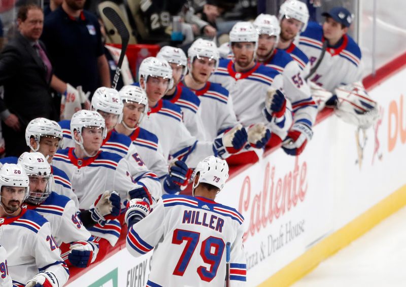 Mar 16, 2024; Pittsburgh, Pennsylvania, USA;  The New York Rangers bench congratulates defenseman K'Andre Miller (79) on his goal against the Pittsburgh Penguins during the third period at PPG Paints Arena. New York won 7-4. Mandatory Credit: Charles LeClaire-USA TODAY Sports