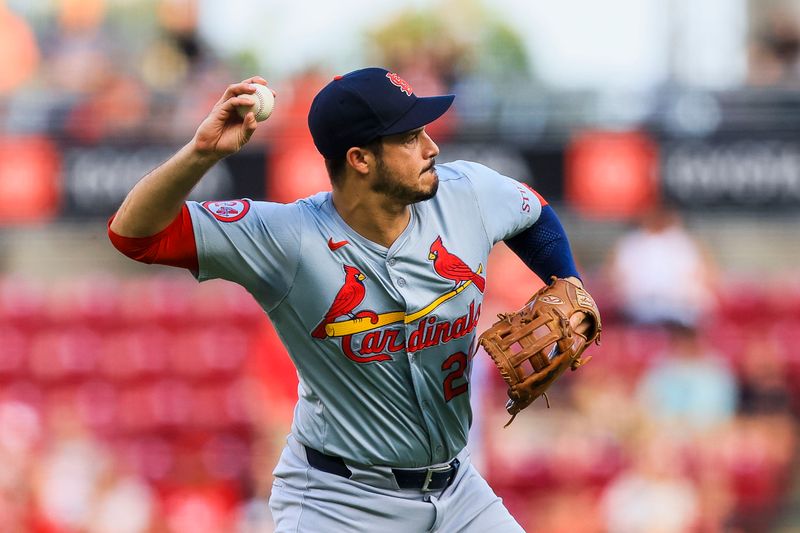 Aug 14, 2024; Cincinnati, Ohio, USA; St. Louis Cardinals third baseman Nolan Arenado (28) throws to first to get Cincinnati Reds designated hitter Jeimer Candelario (not pictured) out in the second inning at Great American Ball Park. Mandatory Credit: Katie Stratman-USA TODAY Sports