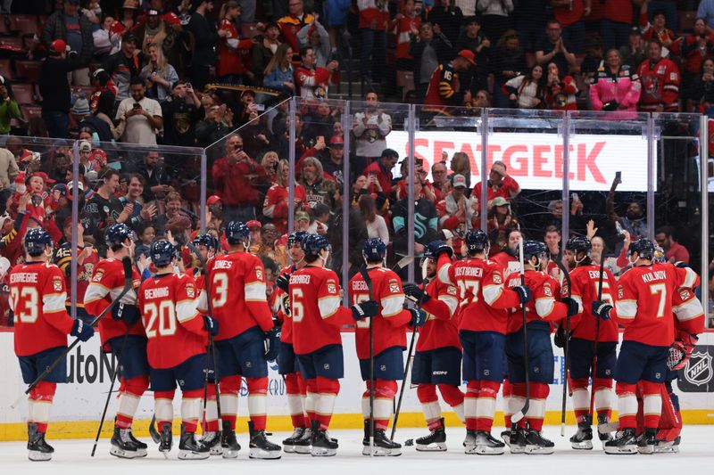 Mar 24, 2026; Sunrise, Florida, USA; Florida Panthers players celebrate after the game against the Seattle Kraken at Amerant Bank Arena. Mandatory Credit: Sam Navarro-Imagn Images