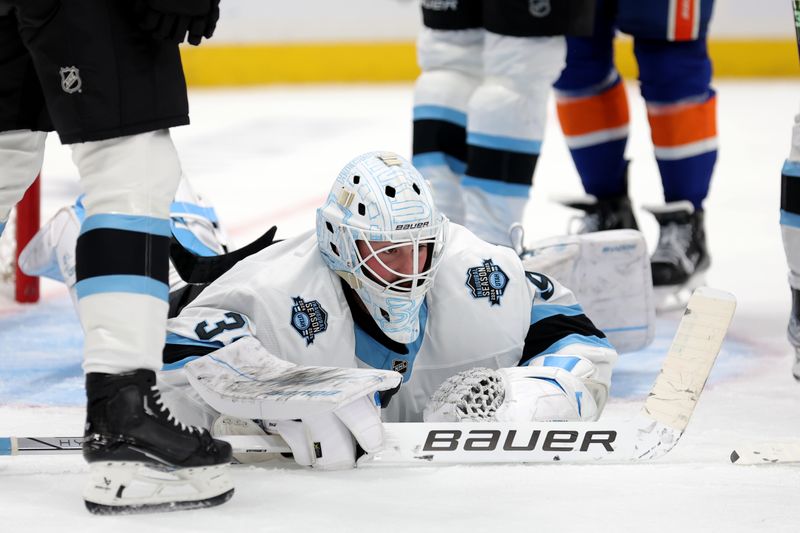 Oct 10, 2024; Elmont, New York, USA; Utah Hockey Club goaltender Connor Ingram (39) reacts after making a save against the New York Islanders during the second period at UBS Arena. Mandatory Credit: Brad Penner-Imagn Images