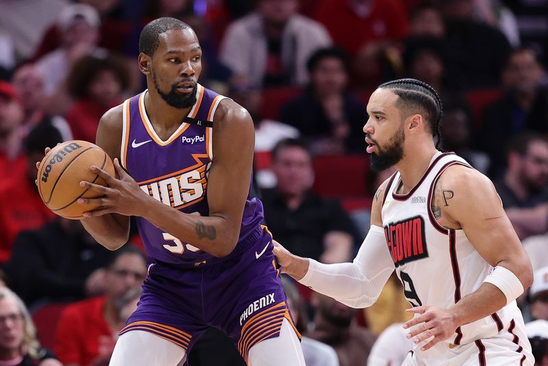 HOUSTON, TEXAS - FEBRUARY 12: Kevin Durant #35 of the Phoenix Suns works against Dillon Brooks #9 of the Houston Rockets during the first half at Toyota Center on February 12, 2025 in Houston, Texas. NOTE TO USER: User expressly acknowledges and agrees that, by downloading and or using this photograph, User is consenting to the terms and conditions of the Getty Images License Agreement. (Photo by Alex Slitz/Getty Images)