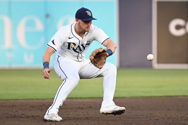 May 8, 2025; St. Petersburg, Florida, USA; Tampa Bay Rays second baseman Curtis Mead (25) fields a ground ball in the second  inning against the Philadelphia Phillies at George M. Steinbrenner Field. Mandatory Credit: Jonathan Dyer-Imagn Images