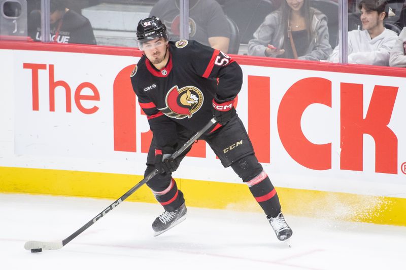 Sep 26, 2024; Ottawa, Ontario, CAN; Ottawa Senators right wing Tyler Boucher (54) controls the puck in the third period against the Buffalo Sabres at the Canadian Tire Centre. Mandatory Credit: Marc DesRosiers-Imagn Images