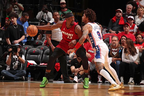 MIAMI, FL - DECEMBER 25:  Kelly Oubre Jr. #9 of the Philadelphia 76ers plays defense during the game  against Bam Adebayo #13 of the Miami Heat on December 25, 2023 at Kaseya Center Arena in Miami, Florida. NOTE TO USER: User expressly acknowledges and agrees that, by downloading and or using this Photograph, user is consenting to the terms and conditions of the Getty Images License Agreement. Mandatory Copyright Notice: Copyright 2023 NBAE (Photo by Issac Baldizon/NBAE via Getty Images)