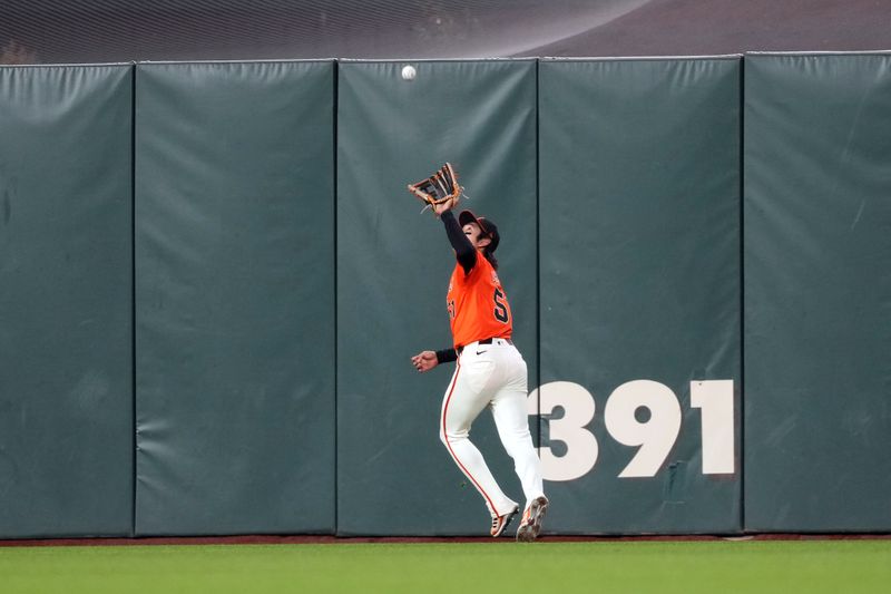 Apr 26, 2024; San Francisco, California, USA; San Francisco Giants outfielder Jung Hoo Lee (51) catches a fly ball against the Pittsburgh Pirates during the fourth inning at Oracle Park. Mandatory Credit: Darren Yamashita-USA TODAY Sports