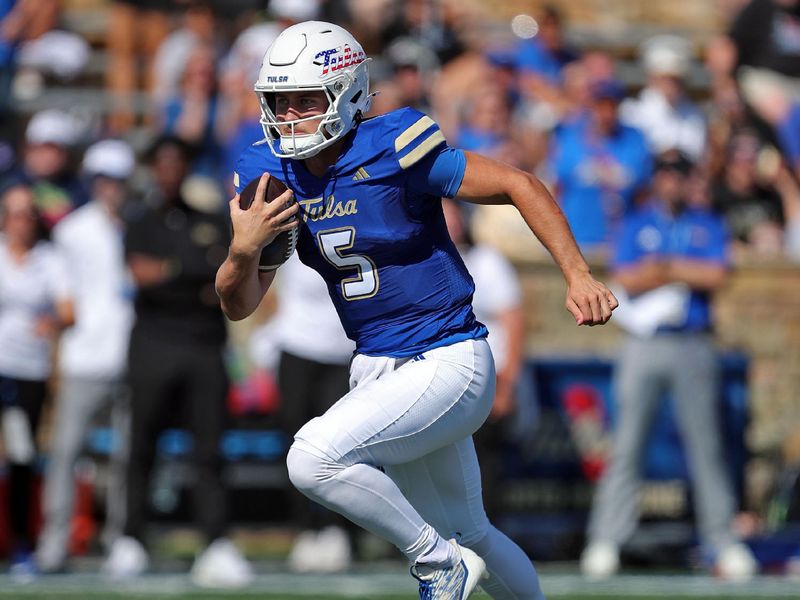 Oct 5, 2024; Tulsa, Oklahoma, USA; Tulsa Golden Hurricane quarterback Cooper Legas (5) carries the ball against the Army Black Knights during the first half at Skelly Field at H.A. Chapman Stadium. Mandatory Credit: Danny Wild-Imagn Images