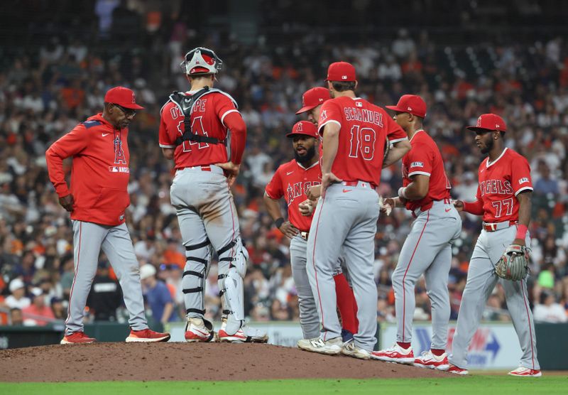 Apr 12, 2025; Houston, Texas, USA; Los Angeles Angels manager Ron Washington walks to the mound for a pitching change during the sixth inning against the Houston Astros at Daikin Park. Mandatory Credit: Troy Taormina-Imagn Images